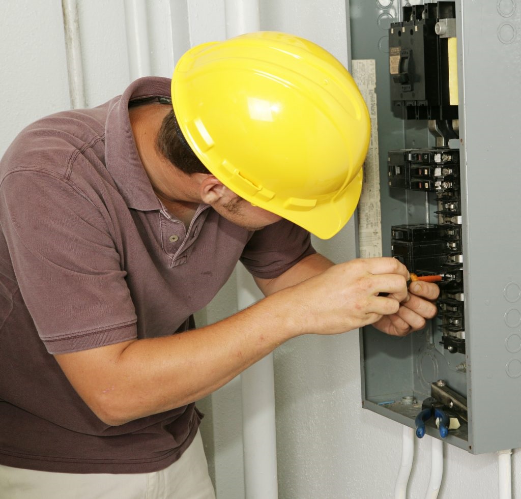Electrician at work on a home's electrical panel