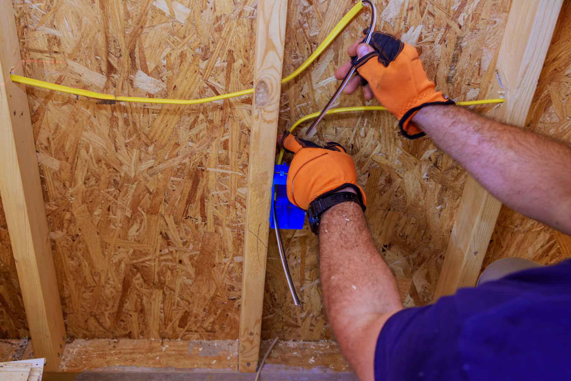 Electrician installing network cable in a home