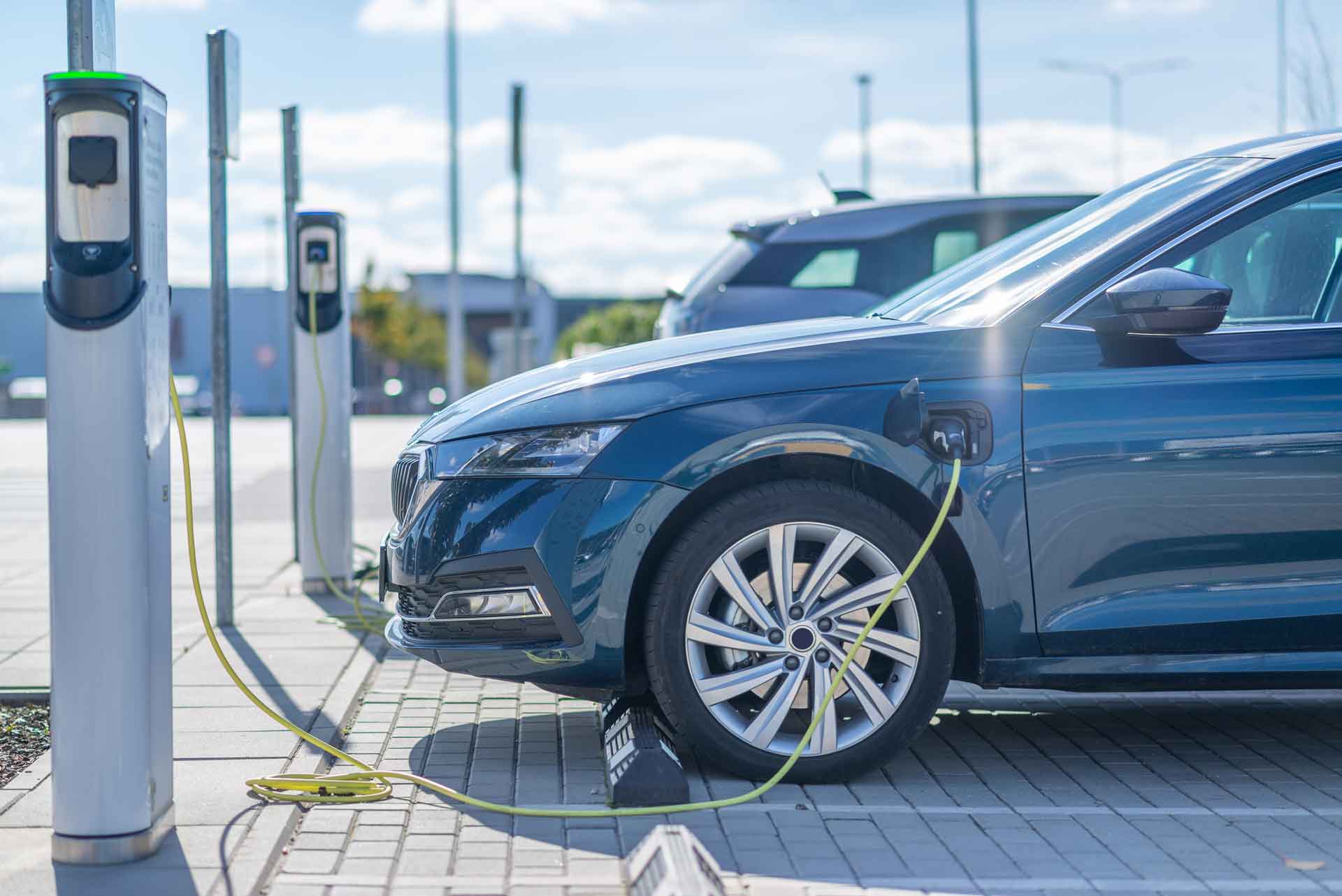 Car plugged in at EV charging station